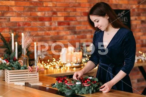 Winter holiday party lady christmas wreath home Stock Photos