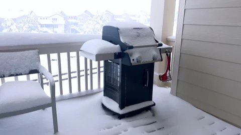 Winter Hush Snow Draped Grill on Suburban Balcony Stock Footage 283475822