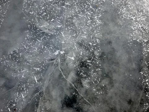 Winter Ice Covers a Surface With Unique Patterns in a Cold Outdoor Setting Stock Photos