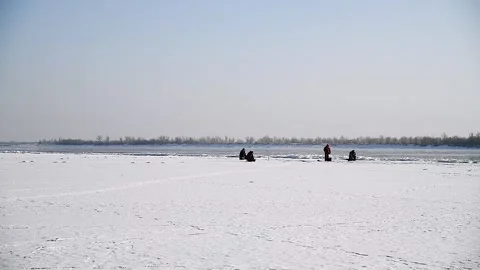Winter ice fishing Stockbeeldmateriaal 237713530