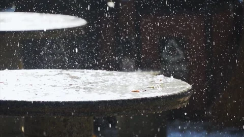 Winter ice melting on stone table with water droplets falling in cold weather Stock Footage 342329117
