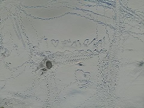 Winter ice pattern background. snow dunes. footprints in the snow. Aerial drone Stock Photos