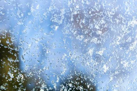 Winter ice pattern on the frozen window. New Year theme. Winter. Cold. Stock Photos