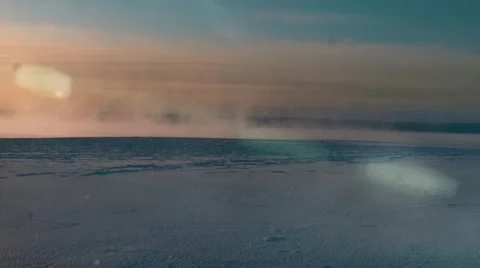 Winter. Ice on the river . Snowy field. Sunset. Sparkling snow. Bulrush. Stock Footage 62071884