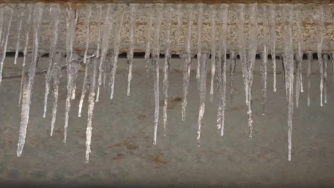 Winter icicles cold ice cones frozen melt dripping water Stock Footage 261795846