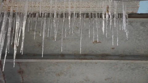 Winter icicles cold ice cones frozen melt dripping water Stock Footage 261814431