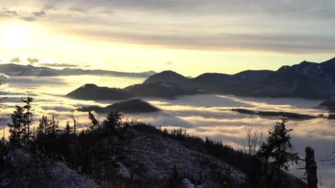 Winter inversion clouds in the mounains at sunset time. Seasonal natural scene w Stock Footage 146141630