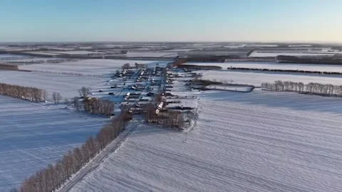 Winter Journey Aerial Forward Flight Toward a Remote Village Hidden in Snowf Stock Footage 328334608