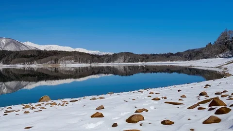 Winter Lake Aoki with mountains landscape in Nagano Prefecture, Japan. Video stock 104873642