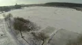 Winter, lake, ice and silhouettes of people. Landscape. Aerial HD Footage