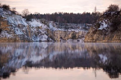 Winter Lake Reflection with Snowy Cliffs Stock Photos