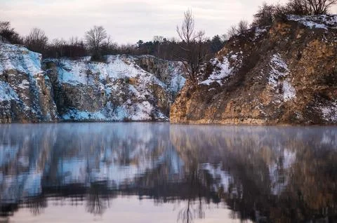 Winter Lake Reflection with Snowy Cliffs Stock Photos