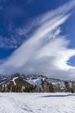 Winter landscape and dramatic clouds Stock Photos