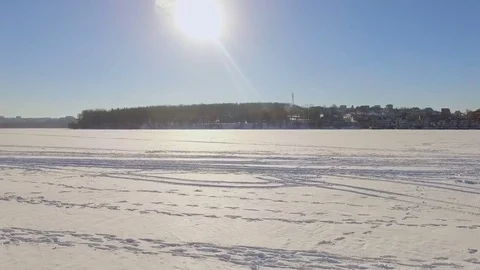 Winter landscape. Beautiful view of the winter city and the lake from a bird's Stock Footage 84415866
