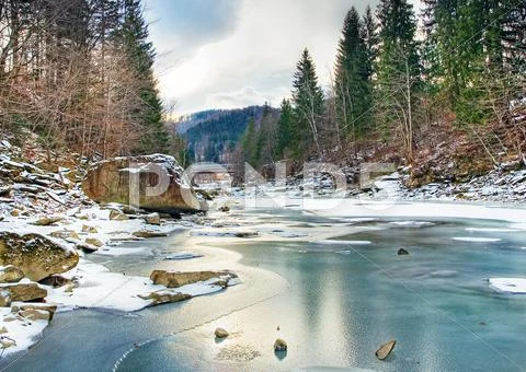Winter landscape with blue water mountain river Stock Photos