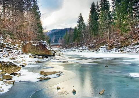 Winter landscape with blue water mountain river Stock Photos