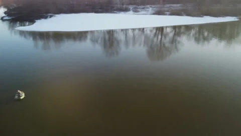Winter landscape with a boat on the river 動画素材 166355122