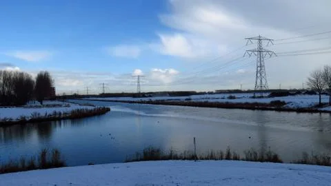 Winter Landscape with Canal Intersection Covered in Snow Stock Photos