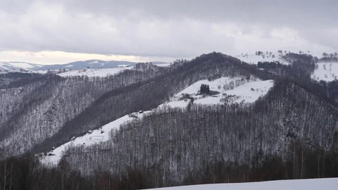 Winter landscape with clouds passing in speed over the snow-covered forests a Stock Footage 78221837