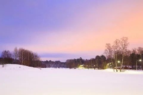 Winter landscape at dusk Stock Photos