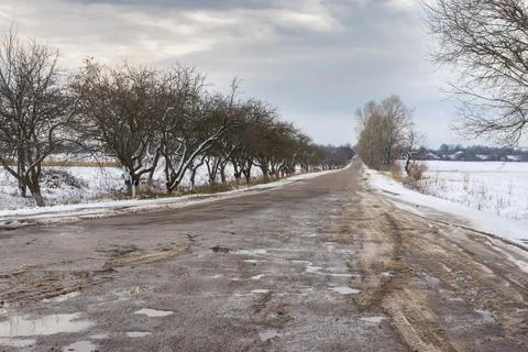 Winter landscape with empty road leading to Velyka Pavlivka village Stock Photos