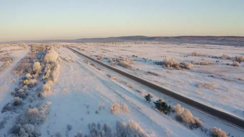 Winter landscape flight over the highway outside the city 库存影片 144464656