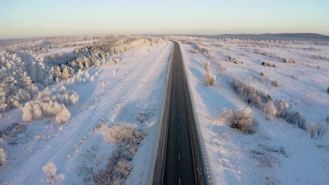 Winter landscape flight over the highway outside the city 库存影片 144481042