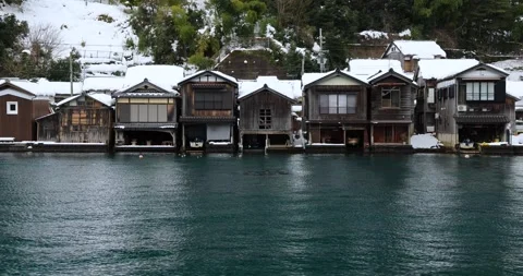 Winter landscape of Funaya boathouses covered in snow in Ine Stock Footage 337451316