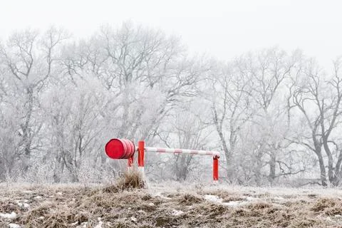 Winter landscape, gate by the river Stock Photos
