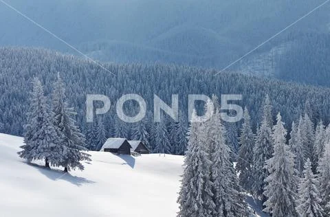 Winter landscape with a house in the mountains Stock Photos