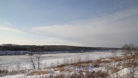 Winter landscape ice drift on the river snow drifts evening light at sunset Stock Footage 95805849