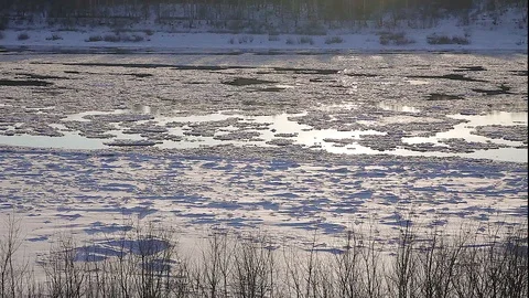 Winter landscape ice drift on the river snow drifts evening light at sunset Stock Footage 95805872