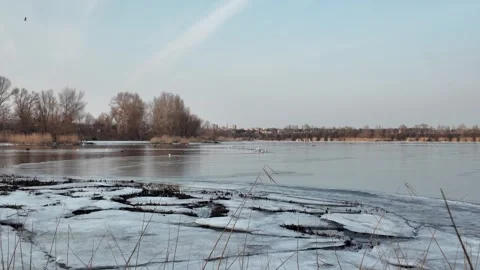 Winter landscape with ice on the river. Cracked ice on the lake. Frosty win.. Stock Footage 303047314