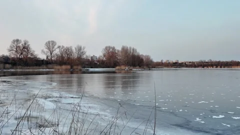 Winter landscape with ice on the river. Cracked ice on the lake. Frosty win.. Video stock 303048491