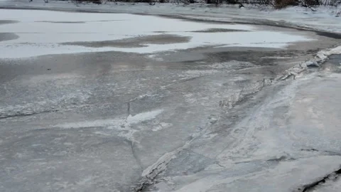 Winter landscape with ice on the river. Cracked ice on the lake. Frosty win.. Video stock 303048636