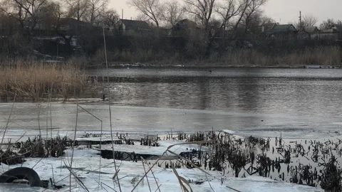 Winter landscape with ice on the river. Cracked ice on the lake. Frosty win.. Video stock 303048767