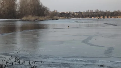 Winter landscape with ice on the river. Cracked ice on the lake. Frosty win.. Video stock 303048809
