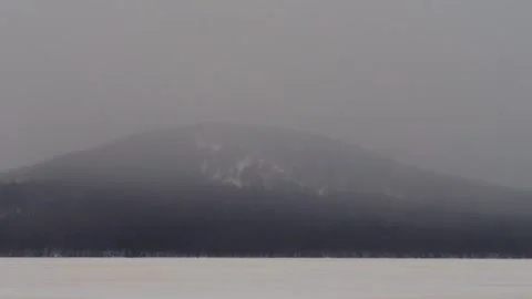 Winter landscape of Mount Kachkanar in the Ural Mountains of Russia on a foggy, Stock Footage 325474582