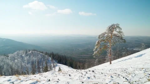 Winter landscape on a mountain range from the top of the mountain. Winter scene. Video stock 264241805