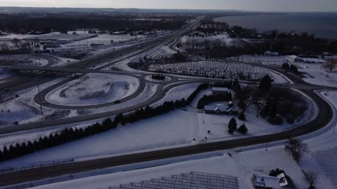 Winter landscape over orchards and highways Stock Footage 230057102