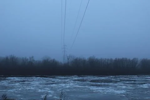 Winter landscape overlooking the river in cold tones Stock Photos