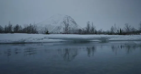 Winter landscape, reflection of a mountain in a river Stock Footage 323647184