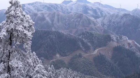 Winter Landscape with Rime-Covered Trees and Winding Mountain Roads Video stock 341958086