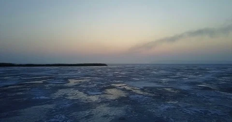 Winter landscape by the river covered with ice Stock Footage 72779462