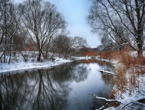 Winter landscape by a river Stock Photos