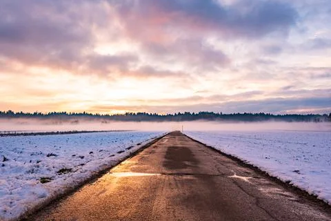 Winter landscape with road, white fields Stock Photos
