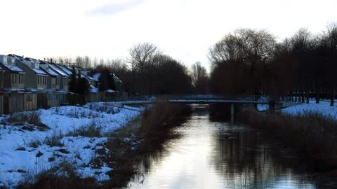 Winter Landscape With Snow Covered Bridge and Canal Stock Photos