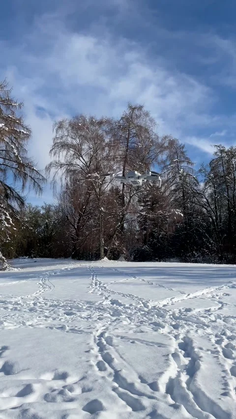 Winter Landscape With Snow-Covered Ground and Trees in Bright Sun Near a Park on Stock Footage 327909189