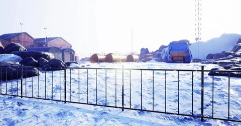 Winter landscape with structures and equipment in a remote location Illustrazione stock