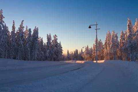 Winter landscape at sunset Stock Photos